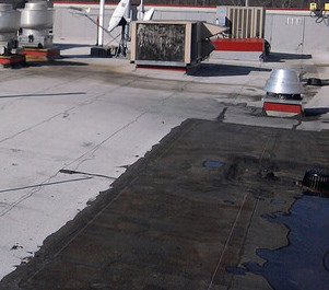 How to inspect flat roof drains